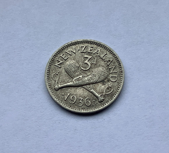 High grade 1936 New Zealand threepence coin. The coin is .500 silver